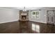 Bright living room with hardwood floors, a stone fireplace, and a view of the outdoors at 175 Springvalley Way, Stockbridge, GA 30281