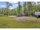 A tranquil lot featuring mature trees and a small structure, offering a serene wooded surrounding with space for an RV at 175 Springvalley Way, Stockbridge, GA 30281