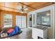 The sun room has a wood ceiling, tile flooring, and a large window at 175 Springvalley Way, Stockbridge, GA 30281