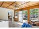 The sun room has a wood ceiling, tile flooring, and access to the exterior of the house at 175 Springvalley Way, Stockbridge, GA 30281