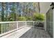 Wooden back deck with white railing overlooking backyard and sliding glass door access to home at 4590 Cedar Ridge Trl, Stone Mountain, GA 30083