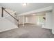 Large finished basement with neutral carpet, white trim, and a sliding glass door for easy outdoor access at 4590 Cedar Ridge Trl, Stone Mountain, GA 30083