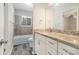 This bathroom offers a vanity with a granite countertop, and a shower/tub with eye-catching tile accents at 4590 Cedar Ridge Trl, Stone Mountain, GA 30083