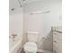 Bright bathroom featuring a shower and tub combination, a toilet and a sink with a granite countertop at 4590 Cedar Ridge Trl, Stone Mountain, GA 30083