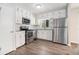 Updated kitchen with white cabinets, stainless steel appliances, and a subway tile backsplash at 4590 Cedar Ridge Trl, Stone Mountain, GA 30083
