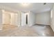 A spacious living room offers plush carpeting, neutral-colored walls, and ample natural light, creating a welcoming ambiance at 4590 Cedar Ridge Trl, Stone Mountain, GA 30083