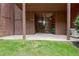 Outdoor back patio overlooking lush lawn and landscaping, including storage area at 5 Northlake Cir # 4 & 5, Peachtree City, GA 30269