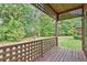 Back porch with lattice railings and wooden deck overlooking yard at 5 Northlake Cir # 4 & 5, Peachtree City, GA 30269