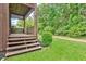 Back porch with wooden deck, lattice railings and green backyard at 5 Northlake Cir # 4 & 5, Peachtree City, GA 30269