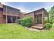 Inviting backyard featuring lush lawn, well-maintained landscaping, and private screened porch at 5 Northlake Cir # 4 & 5, Peachtree City, GA 30269