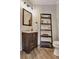 Stylish half-bathroom with modern fixtures and decorative ladder shelf at 5 Northlake Cir # 4 & 5, Peachtree City, GA 30269