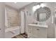 This bathroom features a tub shower with stylish tilework, a modern vanity, and updated fixtures at 5 Northlake Cir # 4 & 5, Peachtree City, GA 30269