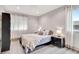Bright bedroom featuring recessed lights, modern flooring, a large window, and neutral colors at 5 Northlake Cir # 4 & 5, Peachtree City, GA 30269