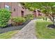 Exterior view featuring well-maintained grounds and a stone pathway leading to the entrance at 5 Northlake Cir # 4 & 5, Peachtree City, GA 30269