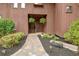 Charming front entrance with stone pathway, mature landscaping, and decorative hanging plants at 5 Northlake Cir # 4 & 5, Peachtree City, GA 30269