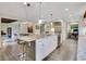 Kitchen featuring stainless steel appliances, white cabinets, an island with seating, and an open layout at 5 Northlake Cir # 4 & 5, Peachtree City, GA 30269