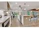 Contemporary kitchen featuring granite countertops, stainless steel appliances, and an island with bar seating at 5 Northlake Cir # 4 & 5, Peachtree City, GA 30269
