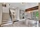 Inviting living room with stairs, view to other living spaces and backyard at 5 Northlake Cir # 4 & 5, Peachtree City, GA 30269