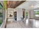 Living room with backyard views, hardwood floors and a view into other living areas at 5 Northlake Cir # 4 & 5, Peachtree City, GA 30269