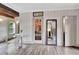 Living room with a view into a wine cellar and hardwood floors at 5 Northlake Cir # 4 & 5, Peachtree City, GA 30269