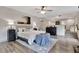 Spacious main bedroom offers hardwood floors, ceiling fan, and ensuite bathroom access at 5 Northlake Cir # 4 & 5, Peachtree City, GA 30269
