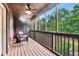 View of screened in porch with wicker furniture and wood ceiling with ceiling fan at 5 Northlake Cir # 4 & 5, Peachtree City, GA 30269