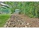 Tranquil waterfront setting with boats on a lake accessible from the backyard via rock drainage feature at 5 Northlake Cir # 4 & 5, Peachtree City, GA 30269
