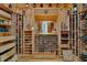 Spacious wine cellar featuring custom wooden shelving and climate control at 5 Northlake Cir # 4 & 5, Peachtree City, GA 30269