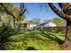 Scenic backyard with a privacy fence, lush green grass, and mature trees offering ample shade at 3120 Church St, Atlanta, GA 30344