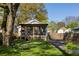 Well-maintained backyard with a fire pit and screened-in porch at 3120 Church St, Atlanta, GA 30344