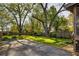 Spacious backyard with a gravel parking pad, mature trees and plenty of space for outdoor entertaining at 3120 Church St, Atlanta, GA 30344