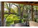 Screened-in porch overlooks a lush backyard with mature trees at 3120 Church St, Atlanta, GA 30344