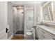 Modern bathroom featuring a glass shower, marble countertop, and sleek fixtures at 3120 Church St, Atlanta, GA 30344