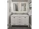 Bathroom vanity featuring double sinks, marble countertops, and gray walls at 3120 Church St, Atlanta, GA 30344
