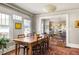 Bright dining room featuring hardwood floors, windows, pendant light and vintage furniture at 3120 Church St, Atlanta, GA 30344