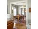 Dining room showcasing hardwood floors, a large wood table and view into the kitchen at 3120 Church St, Atlanta, GA 30344