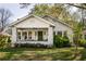 Charming single-story home with a welcoming front porch, green door and well-maintained lawn at 3120 Church St, Atlanta, GA 30344