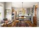 Bright kitchen with stainless steel appliances, gray cabinets, an island table and colorful rug at 3120 Church St, Atlanta, GA 30344