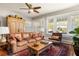 Warm living room with hardwood floors, area rug and view to the outside through the windows at 3120 Church St, Atlanta, GA 30344