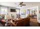 Cozy living room with fireplace, hardwood floors, and view into the dining room at 3120 Church St, Atlanta, GA 30344
