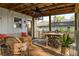 Inviting screened-in porch with ample seating and a dining area at 3120 Church St, Atlanta, GA 30344