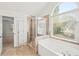 Bright bathroom with a soaking tub, walk-in shower, and natural light at 510 Towneside Ln, Marietta, GA 30064
