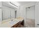 Bright bathroom featuring a vanity with sink and a large mirror at 510 Towneside Ln, Marietta, GA 30064