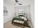 Cozy bedroom features an olive green comforter, decorative lighting, and a giraffe painting at 510 Towneside Ln, Marietta, GA 30064