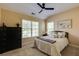Cozy bedroom with a black dresser, comfortable bed and natural light at 510 Towneside Ln, Marietta, GA 30064