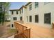 Spacious wooden deck overlooking backyard of two-story home with neutral siding and dark trim windows at 510 Towneside Ln, Marietta, GA 30064