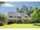 Beautiful two-story home featuring a well-manicured lawn, brick accents, and dark shutters against light siding at 510 Towneside Ln, Marietta, GA 30064