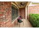 Cozy front porch featuring brick accents, a ceiling fan, and comfortable seating for relaxing at 510 Towneside Ln, Marietta, GA 30064