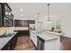 Modern kitchen featuring stainless steel appliances, granite counters, and seamless transition to breakfast area at 510 Towneside Ln, Marietta, GA 30064