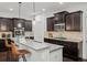 Elegant kitchen with dark wood cabinets, granite countertops, and stainless steel appliances for modern living at 510 Towneside Ln, Marietta, GA 30064